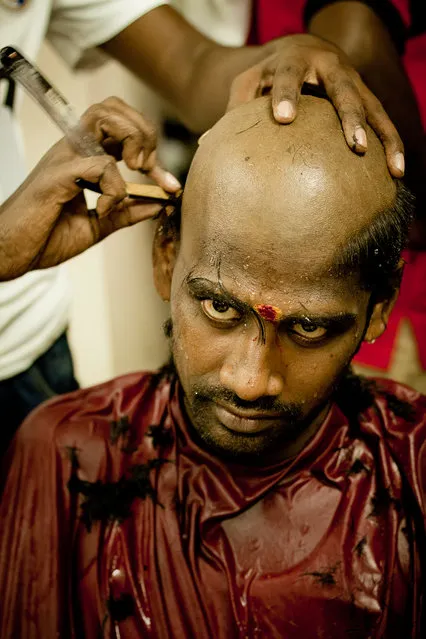 “The great determination”. The Thaipusam devotees would shave their heads (chaulam) during the Thaipusam before their spiritual journey to fulfil vows and as a symbol of humility and penance. I choose to portrait this honest moment during hair shaving to etch out his inner heart and high level of spiritual commitment towards his fulfillment of his vows to the Lord from his eyes. His eyes demonstrated the spiritual energy, courage and willpower, the confidence to undertake any work or fulfil any dream. Location: Batu Caves, Malaysia. (Photo and caption by Yew Kiat Soh/National Geographic Traveler Photo Contest)