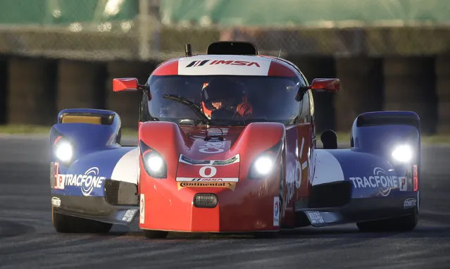 Memo Rojas, of Mexico, drives the Delta Wing DWC13 Elan through a horseshoe turn while qualifying for the IMSA 24 hour auto race at Daytona International Speedway, Thursday, January 22, 2015, in Daytona Beach, Fla. (Photo by John Raoux/AP Photo)