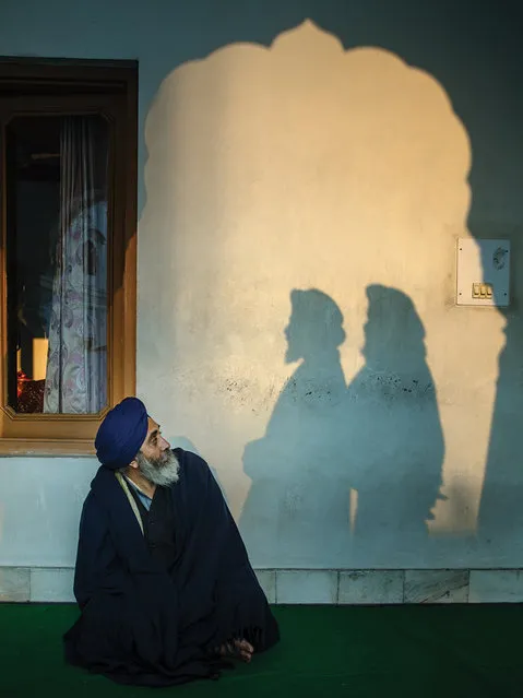 “Amritsar, Punjab. I was photographing this man when two shadows appeared. This shot can be interpreted as a reflection on Sikhism, the nature of the Sikhs, the relationship they have with their past, their present and their future”. (Photo by Serge Bouvet/The Guardian)