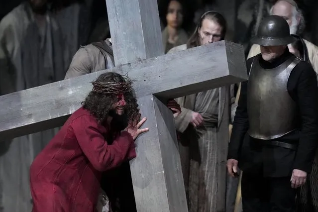 Rochus Rueckel as Jesus peforms with cast members during the rehearsal of the 42nd Passion Play in Oberammergau, Germany, Wednesday, May 4, 2022. After a two-year delay due to the coronavirus, Germany's famous Oberammergau Passion Play is opening soon. The play dates back to 1634, when Catholic residents of a small Bavarian village vowed to perform a play of the last days of Jesus Christ every 10 years, if only God would spare them of any further Black Death victims. The town did suffer some COVID-19 deaths, but the show goes on. Almost half of the village's residents – more than 1,800 people including 400 children – will participate. (Photo by Matthias Schrader/AP Photo)