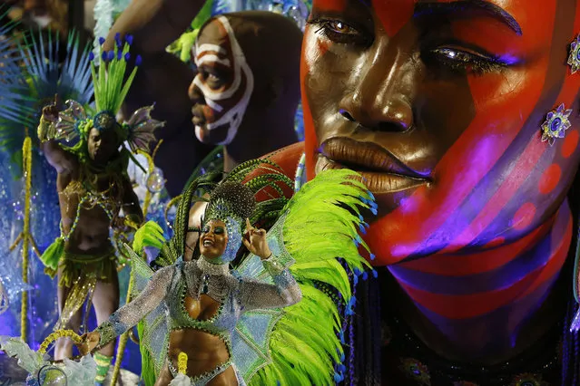 A performer from the Imperatriz Leopoldinense samba school parades during carnival celebrations at the Sambadrome in Rio de Janeiro, Brazil, Tuesday, February 17, 2015. (Photo by Leo Correa/AP Photo)