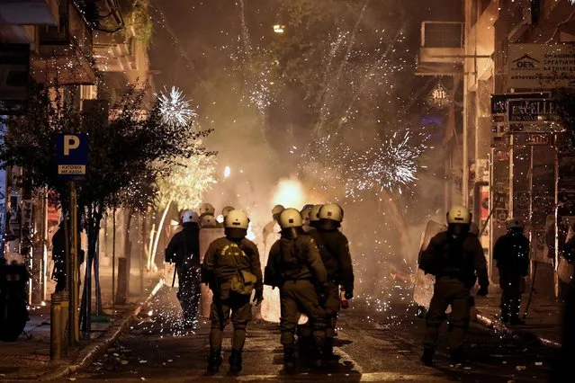 Fireworks explode next to riot police during clashes following an anniversary rally marking the 2008 police shooting of 15-year-old student, Alexandros Grigoropoulos, in Athens, Greece, December 6, 2016. (Photo by Alkis Konstantinidis/Reuters)