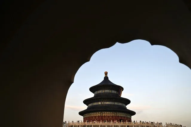 People visit the Temple of Heaven in Beijing on October 10, 2023. (Photo by Pedro Pardo/AFP Photo)