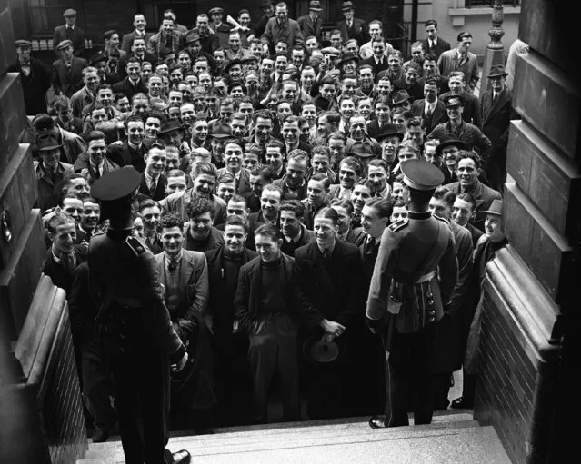 Part of the huge batch of men who arrived at the recruiting office in Great Scotland Yard, London on May 2, 1939. The push to increase the regular army has been increased by the introduction of the conscription bill. There is no difference in normal long-term recruiting, which is still on a strictly voluntary basis. (Photo by AP Photo/Staff/Puttnam)