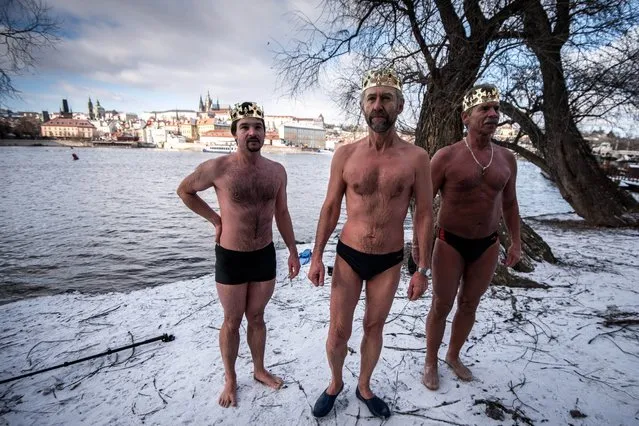 Winter swimmers attend the traditional Three Kings (Epiphany)  swim in the Vltava river Prague, Czech Republic on January 6, 2017. About thirty swimmers took part in water temperatures of 0,9C, air temperature -8C. (Photo by Lukas Kabon/Anadolu Agency/Getty Images)