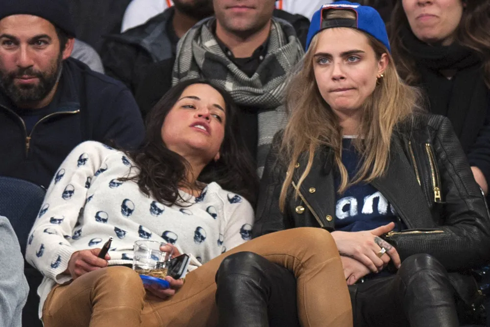 Michelle Rodriguez & Cara Delevigne Share Drunk Kiss at Knicks Game