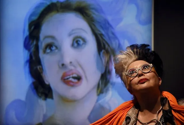 French artist “ORLAN” poses next to a photographic portrait of herself superimposed with Botticelli's Venus at the Victoria and Albert museum in London, Britain, March 2, 2016. (Photo by Toby Melville/Reuters)