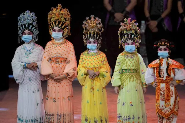 Children perform Cantonese opera during a variety show to mark the China's 72nd National Day in Hong Kong Friday, October 1, 2021. Police in Hong Kong halted a four-person pro-democracy protest on China's National Day Friday amid an expanding crackdown on free speech and opposition politics. (Photo by Kin Cheung/AP Photo)