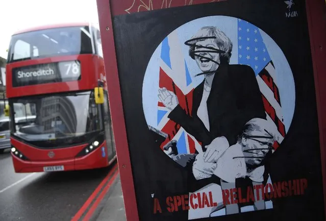 A bus drives past a mural depicting U.S. President Donald Trump and British Prime Minister Theresa May, in London, Britain, February 7, 2017. (Photo by Toby Melville/Reuters)