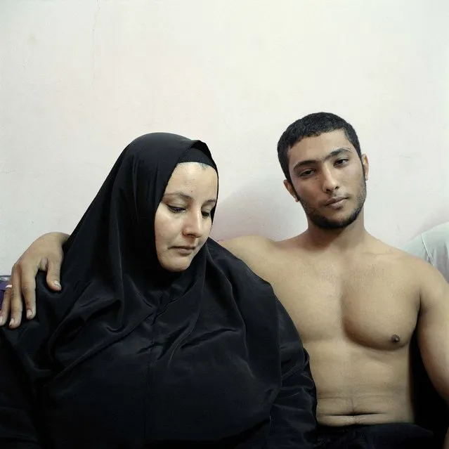 2nd prize in the People Staged Portraits Stories category. Denis Dailleux, France, for Agence Vu. The photo shows Ali, a young Egyptian bodybuilder, posing with his mother in Cairo. (Photo by Denis Dailleux/World Press Photo)