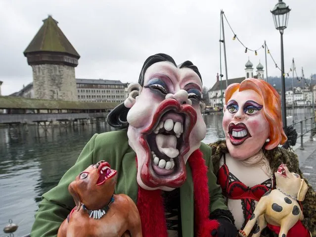 Participants dressed as prostitutes wander the streets of Lucerne. (Photo by Sigi Tischler/Keystone)