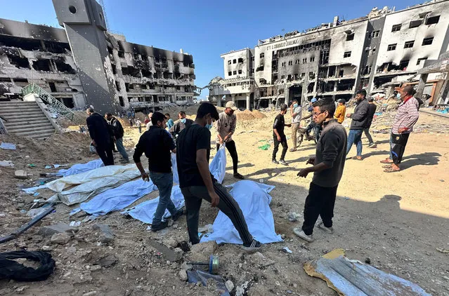 A mass grave is found in the courtyard of the Shifa Hospital in Gaza City, Gaza on April 16, 2024. Dozens of decomposed, burnt, mutilated, mass or single bodies were found in various parts of the hospital courtyard. (Photo by Hamza Qraiqea/Anadolu via Getty Images)
