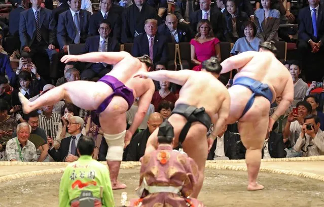 U.S. President Donald Trump, first lady Melania Trump, Japanese Prime Minister Shinzo Abe and wife Akie Abe watch the Summer Grand Sumo Tournament at Ryogoku Kokigikan Sumo Hall in Tokyo, Japan May 26, 2019. (Photo by Jonathan Ernst/Reuters)