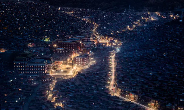 Beautiful but fading light, Tibet. The world’s largest Buddhist academy is Larung Gar. People from all over China come here to learn Buddhism. In June 2016, the Chinese authorities embarked on a plan to reduce the population by demolishing many of the monks’ and nuns’ homes. (Photo by Yuen Hung Neoh/Smithsonian Photo Contest)