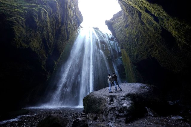 People look at the Gljufrabui waterfall in southern Iceland on Sunday, December 10, 2023. (Photo by Owen Humphreys/PA Images via Getty Images)