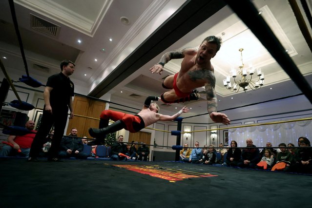 Wrestler Colt Miles performs with Robert McKenzie during Megaslam at the Grand Hotel in Sunderland, Britain, January 9, 2022. (Photo by Lee Smith/Reuters)