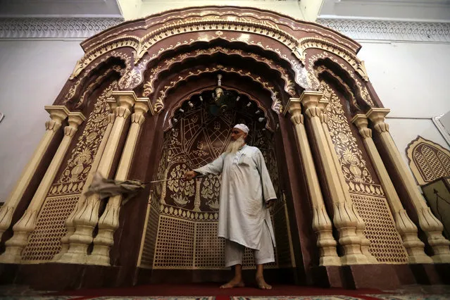 A man cleans a Mosque ahead of the Muslims holy fasting month of Ramadan in Peshawar, Pakistan, 05 May 2019. Muslims around the world celebrate the holy month of Ramadan by praying during the night time and abstaining from eating, drinking, and sexual acts daily between sunrise and sunset. Ramadan is the ninth month in the Islamic calendar and it is believed that the Koran's first verse was revealed during its last 10 nights. (Photo by Bilawal Arbab/EPA/EFE)