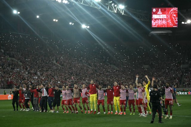 Olympiakos' players celebrate reaching the final of UEFA Europa Conference League in front of their fans after their victory in their semi final second leg football match against Aston Villa at the Georgios Karaiskakis Stadium, in Piraeus, on May 9, 2024. (Photo by Angelos Tzortzinis/AFP Photo)