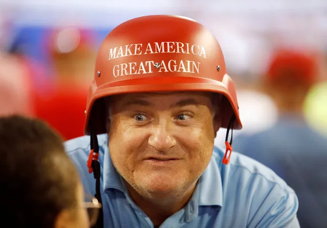 A supporter of U.S. President Donald Trump wears a helmet emblazoned with the “Make America Great Again” slogan, at a “Keep America Great” campaign rally in Greenville, North Carolina, U.S., July 17, 2019. (Photo by Jonathan Drake/Reuters)