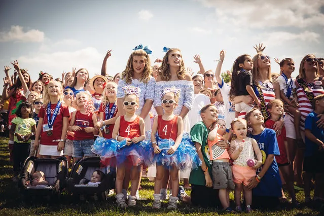 Twins line up for the annual group photo at the Twins Days Festival at Glenn Chamberlin Park on August 3, 2019 in Twinsburg, Ohio. Twins Day celebrates biological twins and has been held every summer since 1976. (Photo by Josie Gealer/Getty Images)