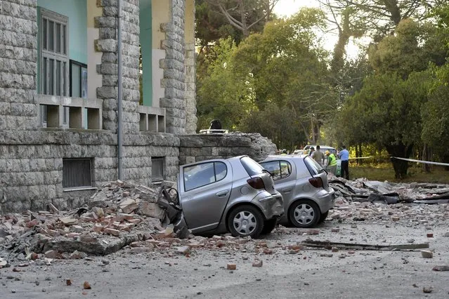Damaged cars outside the Faculty of Geology building after an earthquake in Tirana, Saturday, September 21, 2019. Albania's government and news reports say an earthquake with a preliminary magnitude of 5.8 shook in the country's west and injured at least two people. (Photo by Hektor Pustina/AP Photo)