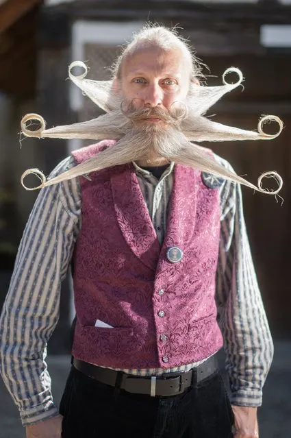 A competitor poses before a beard and moustache competition at the Ecomusee d'Alsace in Ungersheim on April 30, 2017. (Photo by Sebastien Bozon/AFP Photo)