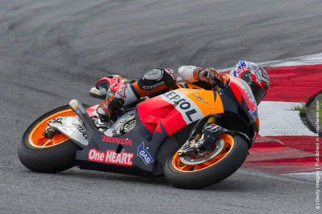 Casey Stoner of Australia and Repsol Honda Team  rounds the bend during the third day of MotoGP testing at Sepang Circuit