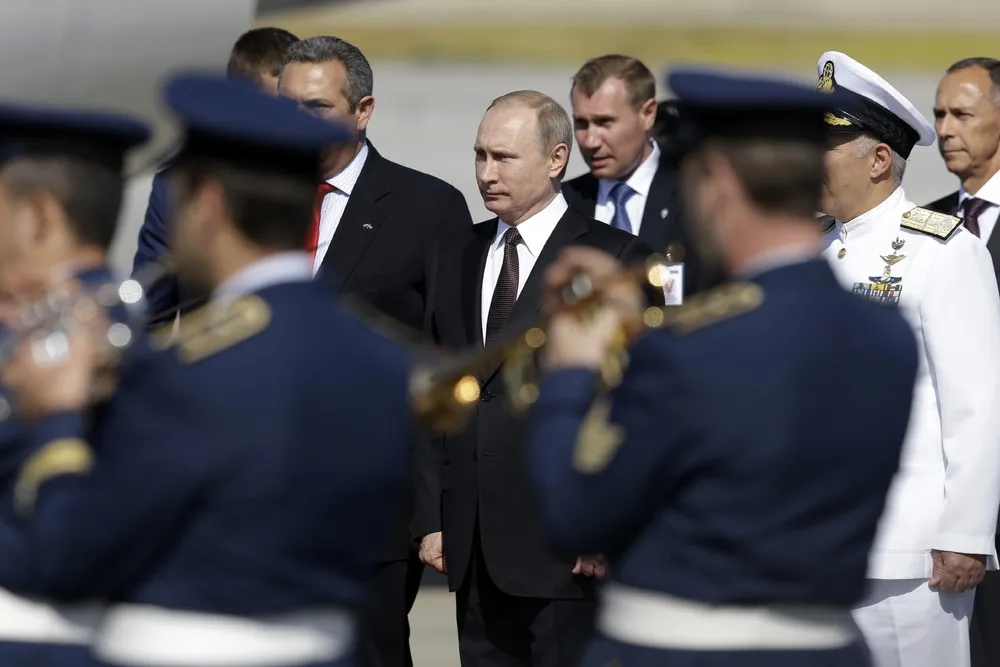 Putin Blasts West on First Trip to EU Country this Year