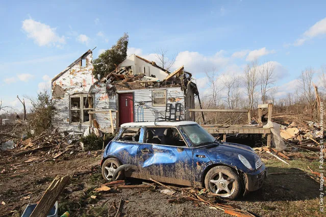 Debris from Friday's EF4 tornado remains scattered around a home March 4, 2012 in Henryville, Indiana