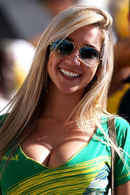 A Brazil fan smiles before the Opening Ceremony of the 2014 FIFA World Cup Brazil prior to the Group A match between Brazil and Croatia at Arena de Sao Paulo on June 12, 2014 in Sao Paulo, Brazil. (Photo by Warren Little/Getty Images)