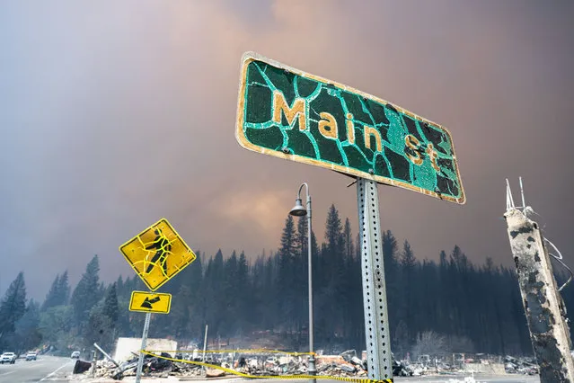 The Main St sign for the town of Greenville is seen destroyed by the Dixie Fire on Thursday, Aug. 5, 2021. The town of Greenville largely destroyed by the Dixie Fire, photographed Thursday August 5th, 2021. The fire burned through the town the day prior, and moved on to threaten other area towns like Taylorsville. As of Thursday morning the fire was over 305,000 acres and 35% contained. (Photo by Stuart W. Palley for The Washington Post)