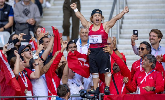 A handout photo made available by OIS/IOC shows Raoua Tlili of Tunisia (C) celebrating winning the Gold Medal with her team in the Para Athletics Women’s Discus Throw - F41 final at the Stade de France during the Paris 2024 Paralympic Games, Paris, France, 04 September 2024. (Photo by Adrian Dennis for OIS/EPA/EFE)