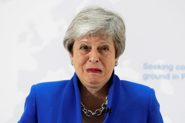 Britain's Prime Minister Theresa May grimaces during her speech on Brexit in London, Britain on May 21, 2019. (Photo by Kirsty Wigglesworth/Pool via Reuters)
