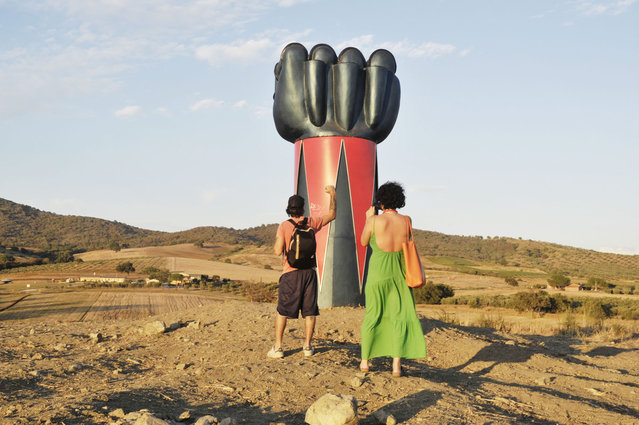 Visitors view a monument dedicated to the Japanese anime television series hero Ufo Robot Goldrake (or Grendizer as it is also known)  called Totem by the artist Moira Ricci  in Collecchio Fonteblanda during Hypermaremma on September 29, 2021 near Grosseto, Italy. (Photo by Laura Lezza/Getty Images)