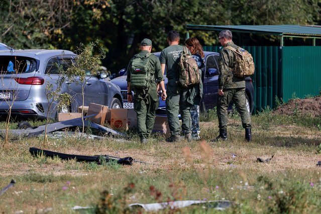 Investigators work in the courtyard of a damaged multi-storey residential building following an alleged Ukrainian drone attack in the course of Russia-Ukraine conflict, in Ramenskoye in the Moscow region, Russia on September 10, 2024. (Photo by Maxim Shemetov/Reuters)