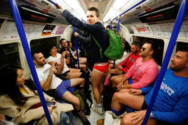 People take part in the annual “No Trousers Tube Ride” event in London, Britain, January 12, 2020. (Photo by Henry Nicholls/Reuters)