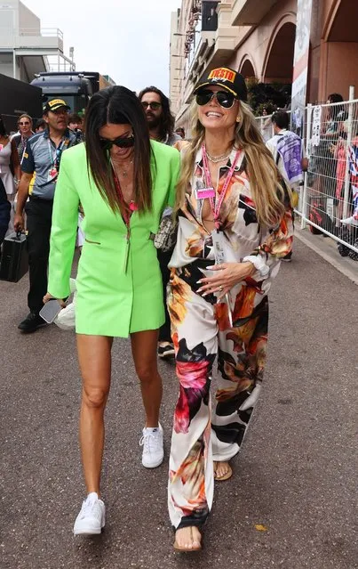 German-American model and television host Heidi Klum (R) and Italian fashion model Elisabetta Gregoraci walk in the Paddock ahead of the F1 Grand Prix of Monaco at Circuit de Monaco on May 29, 2022 in Monte-Carlo, Monaco. (Photo by Clive Rose/Getty Images)