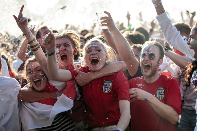England football fans celebrate England's first goal during a Hyde Park screening of the FIFA 2018 World Cup semi-final match between Croatia and England on July 11, 2018 in London, United Kingdom.The winner of this evening's match will go on to play France in Sunday's World Cup final in Moscow. Up to 30,000 free tickets were available by ballot for the biggest London screening of a football match since 1996. (Photo by Jack Taylor/Getty Images)