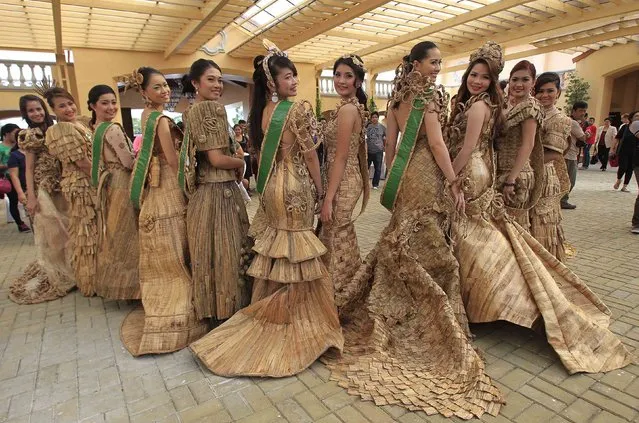 Candidates of the Miss Las Pinas Water Lily beauty pageant pose with their gowns made from dried water lilies during a media presentation in Las Pinas city, south of Manila July 24, 2014. According to the event organiser, the contest is part of events to celebrate the city's annual Water Lily festival. Local residents make gowns, bags and ornaments from parts of the aquatic plant as a source of livelihood. (Photo by Romeo Ranoco/Reuters)