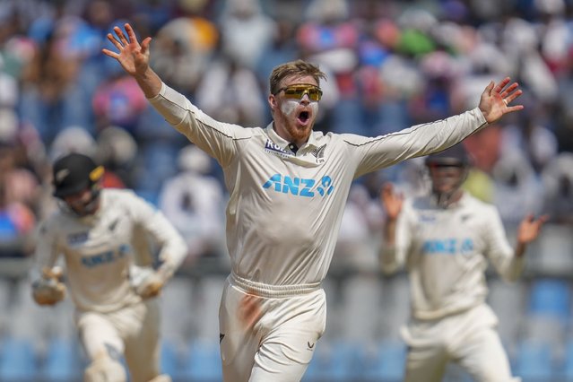 New Zealand's Glenn Phillips celebrates the dismissal of India's Ravichandran Ashwin during the third day of the third cricket test match between India and New Zealand at Wankhede Stadium, in Mumbai, India, Sunday, November 3, 2024. (Photo by Rajanish Kakade/AP Photo)