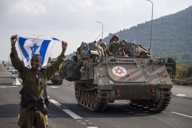 Israeli armored carriers head to the border with Lebanon on Tuesday, October 10, 2023. (Photo by Gil Eliyahu/AP Photo)