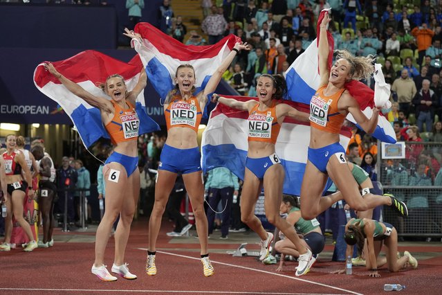 The team of the Netherlands celebrates after winning the gold medal in the Women's 4 X 400 meters relay during the athletics competition in the Olympic Stadium at the European Championships in Munich, Germany, Saturday, August 20, 2022. (Photo by Matthias Schrader/AP Photo)
