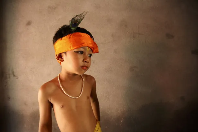 A child is dressed as Lord Krishna near the Krishna Temple during the Krishna Janmashtami festival in Lalitpur August 21, 2011. (Photo by Navesh Chitrakar/Reuters)