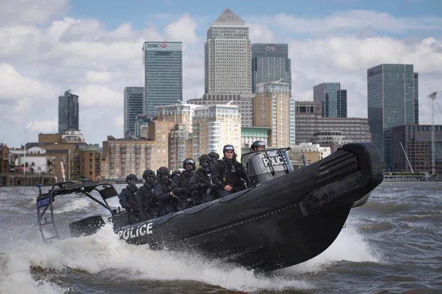 Armed Metropolitan Police counter terrorism officers take part in an exercise on the River Thames in London on August 3, 2016. Metropolitan Police Commissioner Bernard Hogan-Howe and Mayor of London Sadiq Khan announced the start of Operation Hercules in which 600 additional firearms officers will be deployed in visible roles in the capital. (Photo by Stefan Rousseau/AFP Photo)