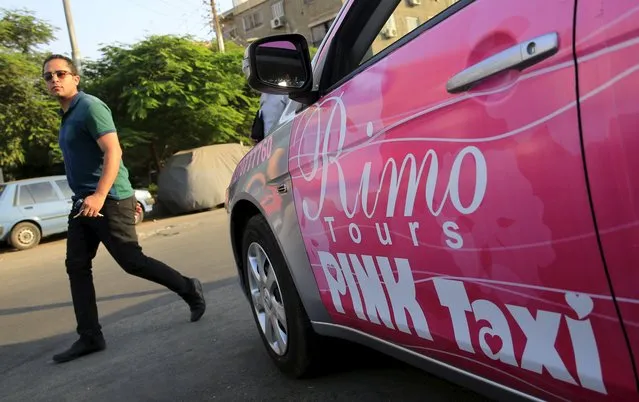 A man walks past a Pink Taxi at a parking lot in Cairo, Egypt, September 6, 2015. (Photo by Amr Abdallah Dalsh/Reuters)