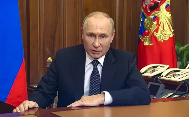 In this image made from video released by the Russian Presidential Press Service, Russian President Vladimir Putin addresses the nation in Moscow, Russia on Wednesday, September 21, 2022. Putin announced a partial mobilization in Russia as the war in Ukraine reaches nearly seven months and Moscow loses ground on the battlefield. Putin also warned the West that “it's not a bluff” that Russia would use all the means at its disposal to protect its territory. The total number of reservists drafted in the partial mobilization is 300,000, officials said. (Russian Presidential Press Service via AP)