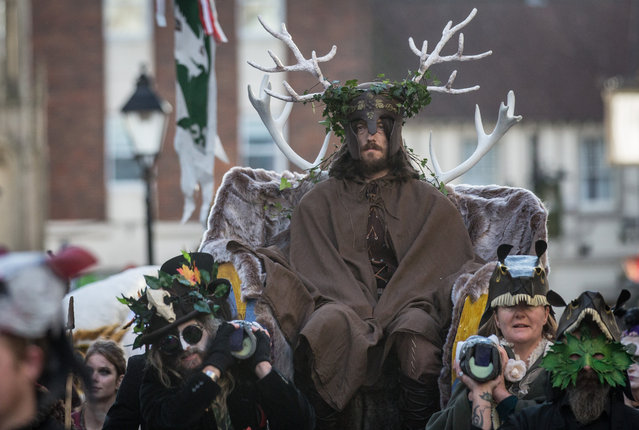 A man representing the Winter King is paraded through the town as he takes part in a ceremony as they celebrate Samhain at the Glastonbury Dragons Samhain Wild Hunt 2017 in Glastonbury on November 4, 2017 in Somerset, England. (Photo by Matt Cardy/Getty Images)