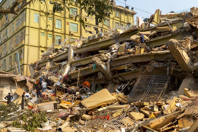 Rescue personnel work at the site of a building that collapsed, following a strong earthquake, in Mandalay, Myanmar, on March 29, 2025. (Photo by Reuters/Stringer)