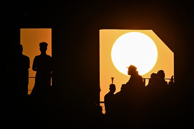 The sun sets before the 2026 FIFA World Cup qualification football match between China and Australia at the Hangzhou Olympic Sports Center Stadium in Hangzhou, in China's eastern Zhejiang province on March 25, 2025. (Photo by Hector Retamal/AFP Photo)