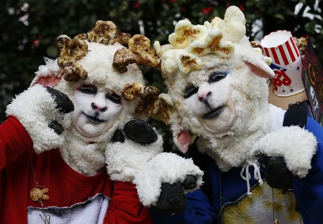Participants in costumes pose for a picture before a Halloween parade in Kawasaki, south of Tokyo, October 26, 2014. (Photo by Yuya Shino/Reuters)